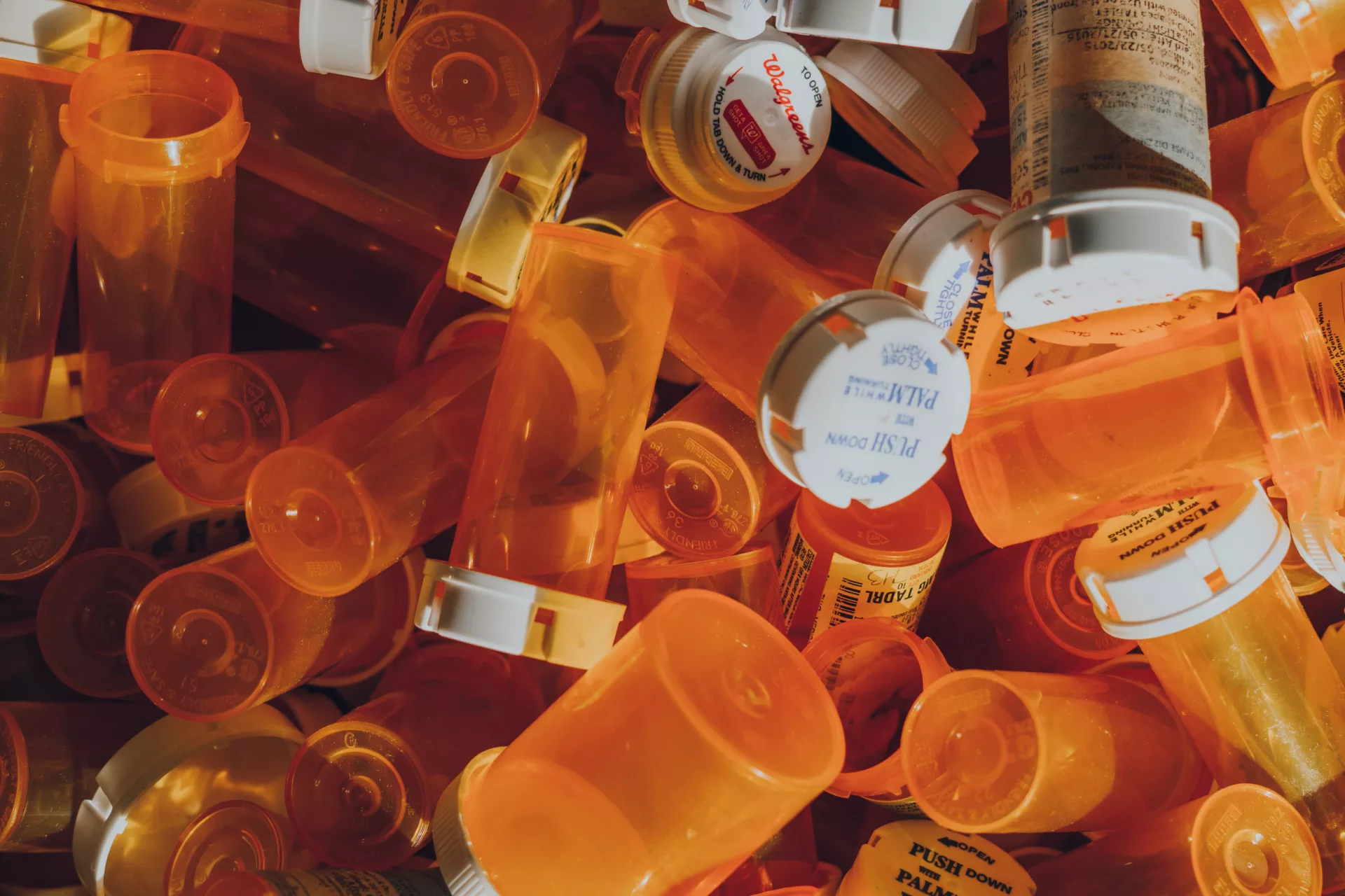 Empty prescription bottles in a pile